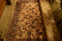 MODERN FLOOR RUG DECORATED WITH LARGE CENTRAL PANEL OF FLORAL DETAIL ON A PALE BACKGROUND, 200CM