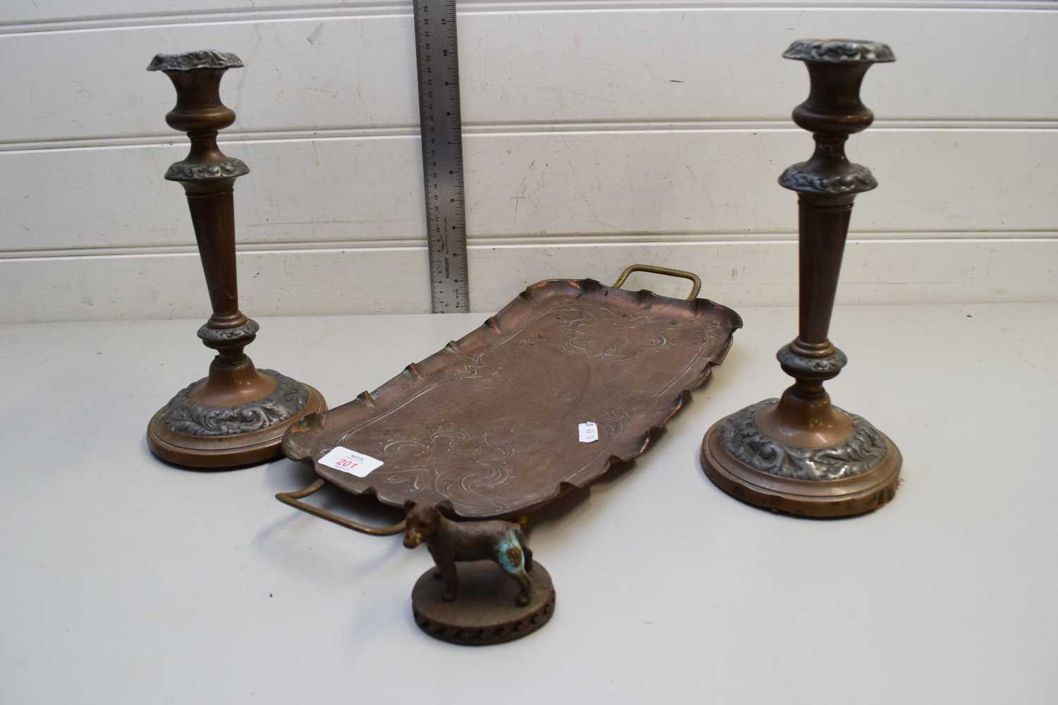 PRESSED COPPER SERVING TRAY TOGETHER WITH A PAIR OF CANDLE STICKS AND A SMALL MODEL DOG (4)