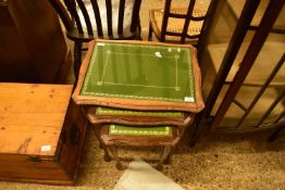 NEST OF THREE LEATHER AND GLASS TOPPED OCCASIONAL TABLES, 55CM WIDE