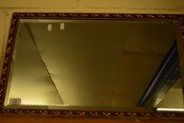 20TH CENTURY RECTANGULAR BEVELLED WALL MIRROR IN GILT FINISH FRAME, 65CM WIDE