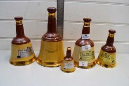 FIVE GRADUATED WADE WHISKY BELLS (EMPTY)