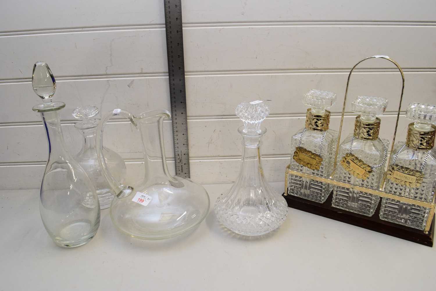 MIXED LOT COMPRISING A MODERN THREE DECANTER TANTALUS, FURTHER GLASS JUG AND THREE FURTHER