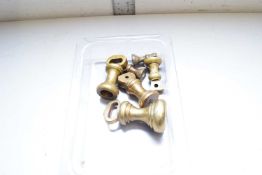 GRADUATED SET OF FIVE SMALL BRASS BELL WEIGHTS