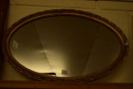 20TH CENTURY OVAL WALL MIRROR IN GILT FINISH FRAME, 62CM WIDE