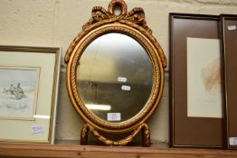 SMALL OVAL WALL MIRROR IN GILT FINISH RIBBON FORMED FRAME