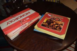 MIXED LOT BOXED MONOPOLY GAMES AND ERIC ROBINSONS WORLD OF MUSIC BOXED RECORD SET AND REMEMBER THE