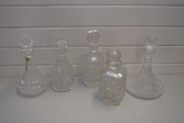 COLLECTION OF FIVE CLEAR GLASS DECANTERS AND A CLEAR GLASS JAR