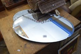 TWO OVAL FRAMED MIRRORS IN CLIP FRAMES, 68CM WIDE