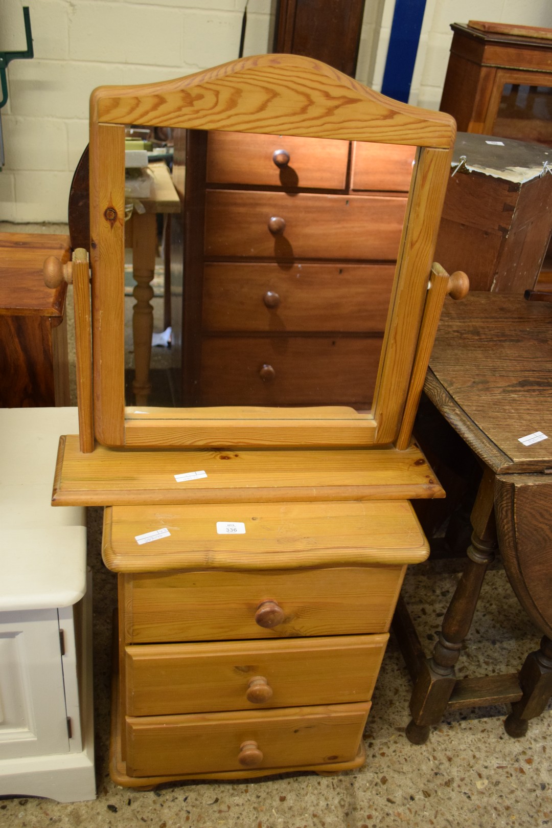 PINE THREE DRAWER BEDSIDE CABINET AND A PINE DRESSING TABLE MIRROR (2)