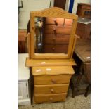 PINE THREE DRAWER BEDSIDE CABINET AND A PINE DRESSING TABLE MIRROR (2)