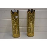 PAIR OF TRENCH ART SHELL CASES DECORATED WITH FLORAL DETAIL ON A PLANISHED BACKGROUND