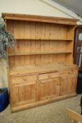 LARGE PINE KITCHEN DRESSER WITH SHELVED BACK OVER A BASE WITH THREE DRAWERS AND THREE DOORS, 180CM