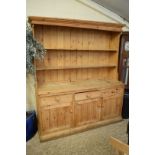 LARGE PINE KITCHEN DRESSER WITH SHELVED BACK OVER A BASE WITH THREE DRAWERS AND THREE DOORS, 180CM