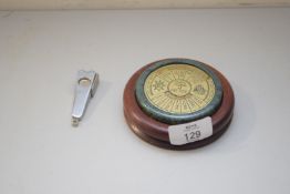 A 40 YEAR DESK CALENDAR TOGETHER WITH A GERMAN STEEL CIGAR CUTTER