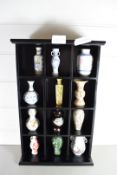 WALL CABINET CONTAINING A COLLECTION OF 12 REPRODUCTION MINIATURE ORIENTAL VASES