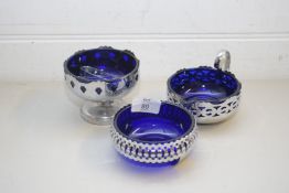 MIXED LOT COMPRISING VARIOUS SILVER PLATED AND BLUE GLASS LINED SUGAR POTS