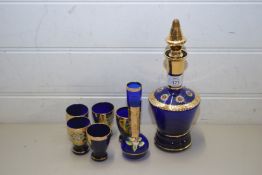 EARLY 20TH CENTURY BOHEMIAN BLUE GLASS AND GILT DECORATED DECANTER AND SPIRIT GLASSES PLUS A FURTHER