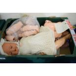 BOX OF ANTIQUE DOLL AND DOLL PARTS CIRCA 1930S