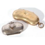 Unusual kidney shaped sovereign or coin holder with three spring loaded apertures to the interior,