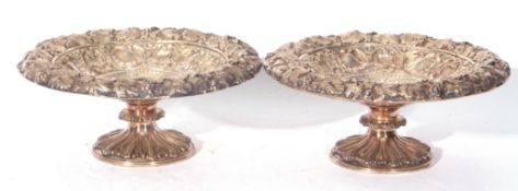 Pair of Victorian heavy gauge silver plated tazzas for circular form, decorated with vine leaf