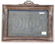 George V rectangular silver mounted photograph frame with easel back and ribbon mount, Birmingham