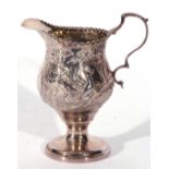 George III silver cream jug of slender helmet shape, sweeping handle and beaded rim, on a raised