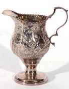 George III silver cream jug of slender helmet shape, sweeping handle and beaded rim, on a raised