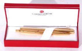 Caran d'Ache of Switzerland cased gold plated Shaeffer fountain pen and accompanying ballpoint pen