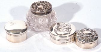 Collection of three various silver and white metal pill boxes, together with a further small cut