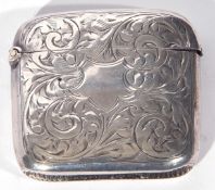 George V silver vesta case of hinged rectangular form decorated with foliate engraving, Birmingham