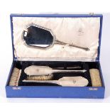 Royal Air Force interest: a George VI silver mounted six piece dressing table set comprising four