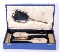 Royal Air Force interest: a George VI silver mounted six piece dressing table set comprising four