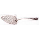 George III silver fish slice/pudding trowel, with a spade shaped blade, embellished with finely