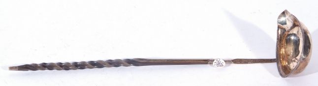 18th century punch ladle with twisted whalebone handle and a silver bowl with beaded edge detail,