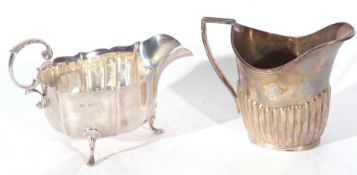 Mixed Lot comprising a George V sauce boat of typical form with wavy rim, scroll handle, supported