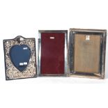 Group of three various silver mounted and easel backed photograph frames, two of rectangular form,