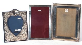 Group of three various silver mounted and easel backed photograph frames, two of rectangular form,