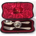 Silver presentation or christening set comprising a spoon, fork and napkin ring, London 1894,