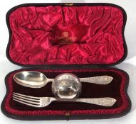 Silver presentation or christening set comprising a spoon, fork and napkin ring, London 1894,