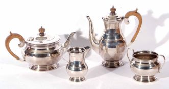 George VI four piece silver tea and coffee service, in the Regent pattern, comprising tea and coffee