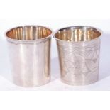 Two Continental white metal beakers of tapering cylindrical form, one with stylised decoration and