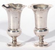 Pair of hallmarked silver vases of campana urn form with crimped rims, bases are weighted, 10cm