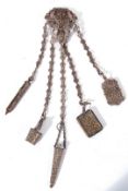 Victorian silver plated chatelaine with five chains to include accessories such as a pencil