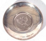 Elizabeth II Britannia standard small circular silver dish or pin tray, the centre decorated with