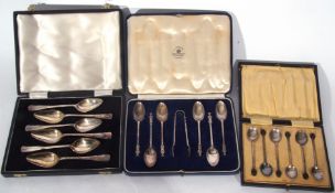 Mixed Lot: comprising a set of six silver apostle topped tea spoons and accompanying sugar tongs set