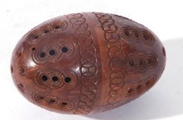 Antique carved coquilla nut pomander formed of two sections with screw thread attachment,