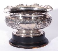 An early 20th century silver plated rose bowl of oval form decorated with stylised floral detail and