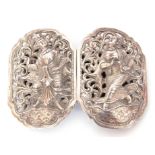 Pair of Far Eastern white metal belt buckles of pierced form decorated with deities, wt approx