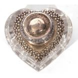 Cut glass heart shaped inkwell, the top with hinged lidded embossed white metal mount, 8.5 x 8cm