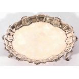 George III small silver waiter tray with shell moulded border and raised on three short swept legs